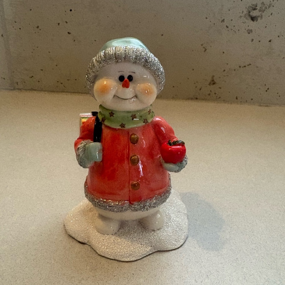 Cheerful Snowman Figurine with Red and Silver Details